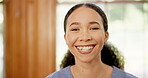 Woman, happy and face of nurse in house, confident and career pride with volunteer care as medical support. Caregiver, smile and portrait for healthcare service, health wellness and trust in about us