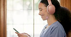 Woman, headphones and smile with phone, nurse and positive mindset for song, audio and playlist. Happy female person, connection and break from work, relax and rest with sound, music and social media