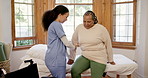 Physiotherapist, senior woman and wheelchair by bed with steps, recovery and healthcare in clinic. Nurse, helping hand and elderly person with disability, injury or rehabilitation in room at hospital