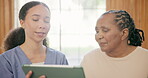 Senior woman, tablet and nurse in consultation, communication and medical report. African caregiver, technology and patient in conversation, healthcare results and information, advice and digital app