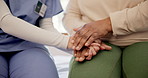 Physiotherapist, holding hands and helping in closeup at clinic with wellness, empathy and kindness. Doctor, nurse and consultation for rehabilitation, recovery and healthcare in room at hospital