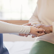 Physiotherapist, holding hands and helping in closeup at hospital with ...