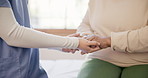 Physiotherapist, holding hands and helping in closeup at hospital with wellness, empathy and kindness. Doctor, nurse and consultation for rehabilitation, recovery and healthcare in room at clinic