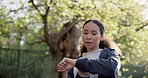 Woman, looking and time for fitness by running, exercise and outside on street. Black person, female runner and training for race, marathon or competition by checking of health, progress and pace