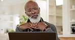 Mature man, laptop and thinking for work from home, solution and freelancer for job, working and email. Vision, serious and technology for strategy, planning or house in kitchen for job, remote or online