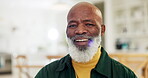 Face, smile and a senior black man in the living room of his retirement home to relax on the weekend. Portrait, funny and a happy elderly person laughing at a meme or joke in his apartment for comedy