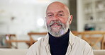 Face, smile and an elderly man in the living room of his retirement home to relax on the weekend. Portrait, funny and a happy senior person laughing at a meme or joke in his apartment for comedy