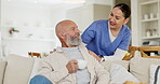 Elderly, man or drinking coffee with caregiver on sofa for talking, check and support in hospice. Senior, person or nurse with relax, tea and peace on couch in living room of retirement home for chat