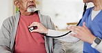 Woman, nurse and hands checking heart beat in elderly care on living room sofa for healthcare at home. Female person, doctor or medical caregiver monitoring senior patient breathing or exam at house