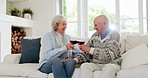 Happy, cheers and senior couple with wine in the living room for bonding together at modern house. Love, smile and elderly man and woman in retirement drinking alcohol on a sofa in the lounge at home