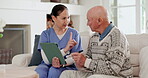 Tablet, medicine and nurse instructions to senior man, healthcare and wellness in retirement on sofa. Caregiver, elderly person and pills with technology, patient support and chronic illness care
