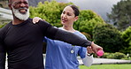 Physiotherapy, nurse and senior man outdoor stretching to exercise injury together in nature. Elderly, person and physio doctor helping body, shoulder pain and warm up muscle with dumbbell in garden