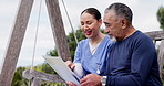 Happy woman, nurse and documents consulting senior patient on park bench for life insurance or relax in nature. Female person or medical doctor sitting, outdoor or talking to mature man in healthcare