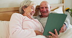 Senior, couple and tablet in bedroom happy or online connection, social media reading or internet scroll. Man, woman or digital connectivity or laugh in home partnership or network, streaming or web