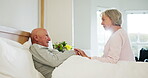 Senior, couple and holding hands in bed for support, sick and conversation with retirement or healing. People, man and woman in bedroom with communication, empathy and love for trust, care and rest