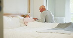 Elderly, couple and holding hands in bed for support, sick and conversation with retirement or healing. People, man and woman in bedroom with communication, empathy and love for trust, care and rest