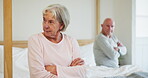 Divorce, conflict and elderly couple in bedroom, fight and marriage crisis in home. Bed, frustrated senior man and woman ignore after cheating, relationship fail and arms crossed, depression and sad