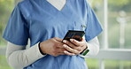 Hands, phone and a nurse closeup in the hospital typing a text message for communication or networking. Healthcare, medical and social media with a medicine professional in the hospital or clinic