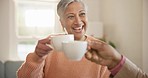 Happy woman, smile and coffee for cheers in home for celebration with friend for health, wellness and diagnosis. Indian person, mature and excited expression on face with hot beverage in living room