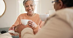 Coffee, offer cake and elderly women in house, friends or happy morning for relax communication. Diversity, senior people or tea talk in retirement for care, laughter or comedy with reunion on sofa