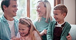 Mother, father and children tickle on sofa for happy connection, kids development on holiday vacation. Man, woman and siblings funny for love care cuddle or hug embrace on couch, relax on weekend