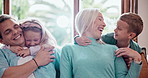 Happy, love and children hugging parents on sofa in the living room of modern family home. Smile, bonding and excited young kids embracing mother and father with care in the lounge together at house