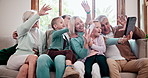 Happy big family, tablet and wave for video call, communication or networking together at home. Parents, grandparents and children smile in hello with technology for virtual greeting on sofa at house