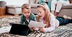 Children, siblings and tablet learning in living room for homework, education on paper. Boy, girl and talking digital  for kid development or online knowledge in remote school, streaming or info chat