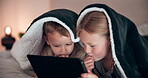 Boy, girl and tablet in bedroom, watching and night in bed, technology and cartoon. Warm blanket, enjoying and online for childhood, digital and internet in family home, games and bonding together