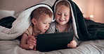 Smile, tablet and children on a bed with a blanket relaxing, bonding and watching a movie or film. Happy, digital technology and kids laying and playing games in bedroom together on weekend in house.