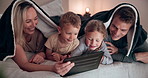 Smile, tablet and family on a bed with a blanket relaxing, bonding and watching a movie or show. Happy, digital technology and children laying and networking with parents in bedroom together in house