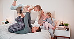 Happy family, playing and airplane game on bed with laughter, love and bonding on weekend in bedroom. Man, woman and children with fantasy plane for freedom, morning relax and health wellness in home