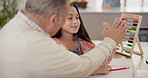 Grandfather, child and high five for learning support, writing development and math solution or achievement at home. Happy family, senior man and girl or kid hands together with school or homework 