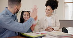 Parents, daughter and homework with high five, happiness and learning support at dining table of home. Family, man or woman with girl child, smile and education in living room of house or apartment