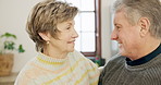 Love, hugging and senior couple in the kitchen cooking a meal for dinner, lunch and supper. Smile, happy and elderly man and woman in retirement embracing for romance in modern home together.