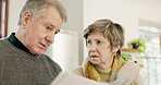 Debt, document and senior couple with stress for mortgage, finance and payment of bills for home. Serious, conversation and elderly people in retirement talk about pension, budget and money strategy