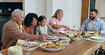 Family, kid and together for dinner in home with healthy, delicious and food on table with bread for plate. Happy man, woman and little girl with smile for talk, conversation or bonding with meal