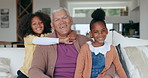 Grandfather, children and hug on sofa with face, smile and love in living room with care in house. Senior man, kids and embrace together on lounge couch in happy family home for bonding in retirement