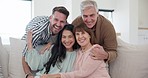 Hug, senior parents and daughter and son on sofa for bonding, love and affection in home. Happy family, portrait and adult children visit mature mom and dad for embrace, relax or fun in living room