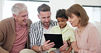 Father, grandparents and kid on tablet for home education, e learning support or watch video together on sofa. Interracial family, child and senior people on digital technology for school or games