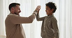 Family, high five and father with boy child in a bedroom for fun, games or bond in their home together. Love, Jewish and dad with kid in a house for hands, motivation or support, conversation or care