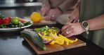 Food, hands and cooking, couple in kitchen together with vegetables and cutting board on counter. Health, wellness or nutrition, man and woman helping with meal prep for lunch, dinner or diet in home