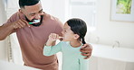 Happy father, child and brushing teeth in bathroom for dental care, hygiene or morning routine together at home. Dad and little girl or kid cleaning with smile for tooth whitening, gum and mouth