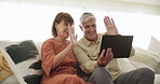 Tablet, wave and video call with a senior couple in their home together for internet communication. Technology, smile or happy with an elderly man and woman talking online for virtual networking