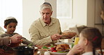 Jewish family lunch, love and food with senior man, son and kid in their home together for Hanukkah, feast or celebration. Event, nutrition and elderly male father breaking bread for meal tradition