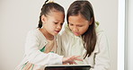 Children, girls and tablet in home for video game, educational elearning website or reading ebook story together. Kids watching cartoon, streaming digital multimedia and scroll to download gaming app