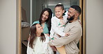 Happy, family and hug in new home with love, support and care together with a smile and parents. Children, house and real estate with dad, mother and kids in a living room with bonding and sibling