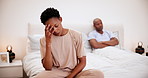 Frustrated, stress and black couple in bedroom, conflict and marriage problem or divorce fight in home. African woman angry at man in relationship in bed, fail or cheating crisis, sad or depression