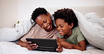 Black mother, smile and child on tablet in bedroom, learning and watch cartoon, movie and video together in blanket. African kid, tech and mom on bed, talking on internet app and family relax in home