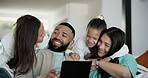 Kids running, hug and parents on a sofa with tablet for streaming, social media or chat in their home together. Love, happy family and excited children embrace people in a living room with support